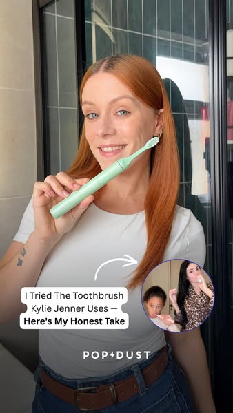 This image ad features a woman holding a light green electric toothbrush and giving her honest review of it after seeing