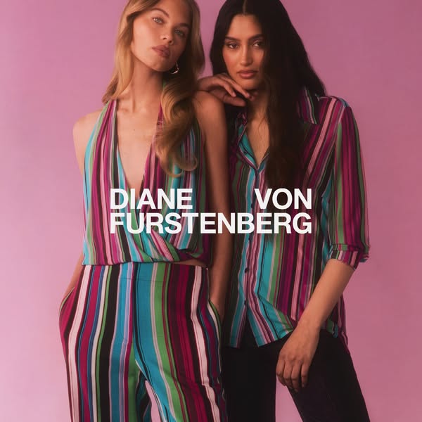 This image ad features two women modeling clothing from Diane Von Furstenberg. The ad is set against a pink background a