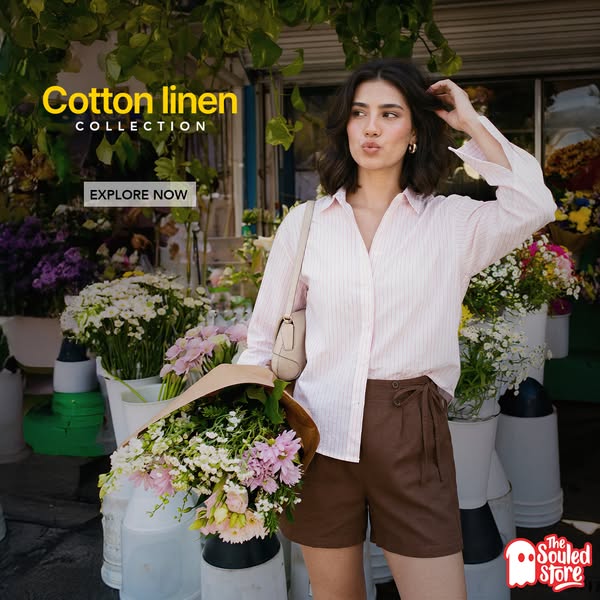 This image ad showcases a young woman in a cotton linen outfit from The Souled Store. She is holding flowers with the te