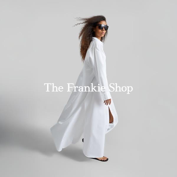 The ad features a woman modeling a white shirt dress and sunglasses from The Frankie Shop, set against a pale gray backd
