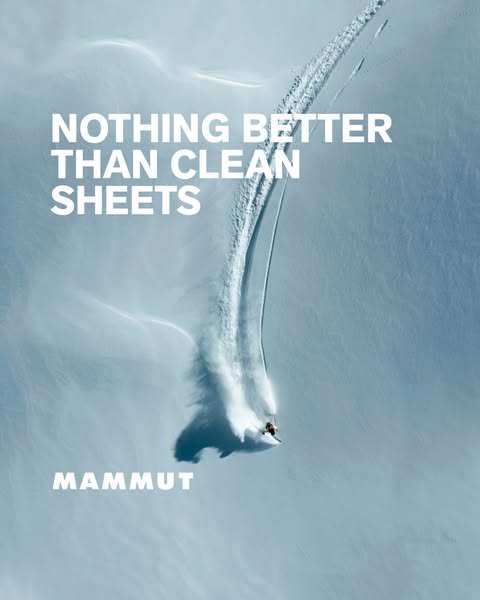 This image ad for Mammut features a skier making a fresh track down a snowy mountain. The ad uses the headline "NOT