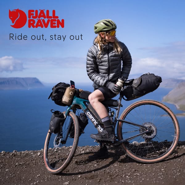 An outdoor lifestyle ad featuring a person on a bicycle with outdoor gear by the brand Fjallraven, with the headline &qu