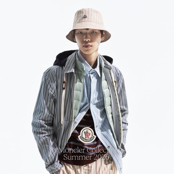 This ad promotes the Moncler Collection for Summer 2026, showcasing a stylish ensemble featuring striped patterns, a buc