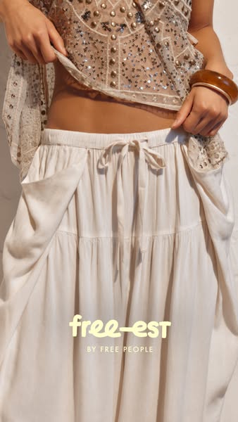 This image ad shows a model from the waist down wearing a Free People maxi skirt, styled with a sequined top. The brand 
