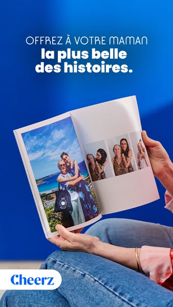 This ad promotes a service that allows you to create photo books. The image shows a woman holding and looking at a photo