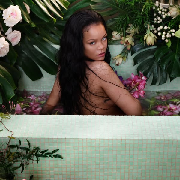 This image ad features Rihanna in a bathtub surrounded by flowers, implying the use of beauty products within a self car