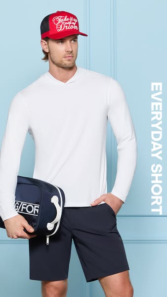 A close-up studio shot of a male model wearing G/FORE clothing. The focus is on the shorts with the brand name visible o