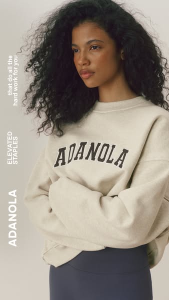 This ad features a woman wearing a crewneck sweatshirt from Adanola with the brand name emblazoned across the front. The