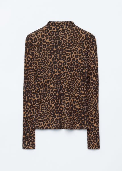 This image ad showcases a long-sleeve turtleneck shirt with a leopard print.