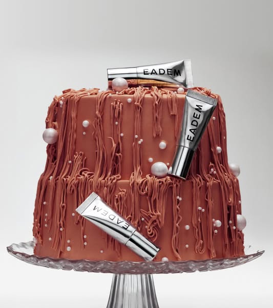 This image ad features skincare products arranged on and around a two-tiered cake to create an eye-catching visual.