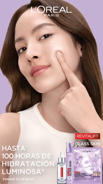 This L'Oreal ad features a light-skinned woman touching her face to demonstrate the effects of the Revitalift Glass 