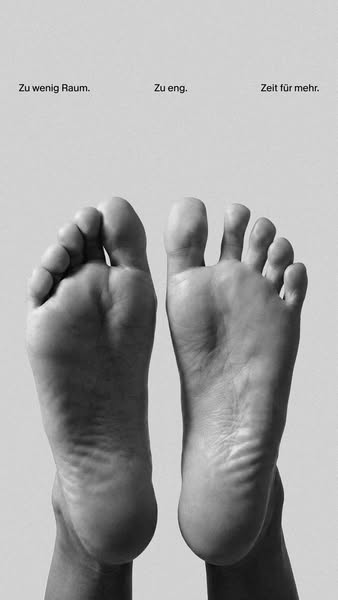 This black-and-white image ad suggests a need for more comfort and space, featuring an up-close image of bare feet and t