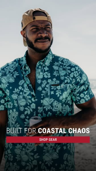 This image ad showcases clothing from the brand Coastal Chaos. The ad features a man wearing a button up shirt with a fl