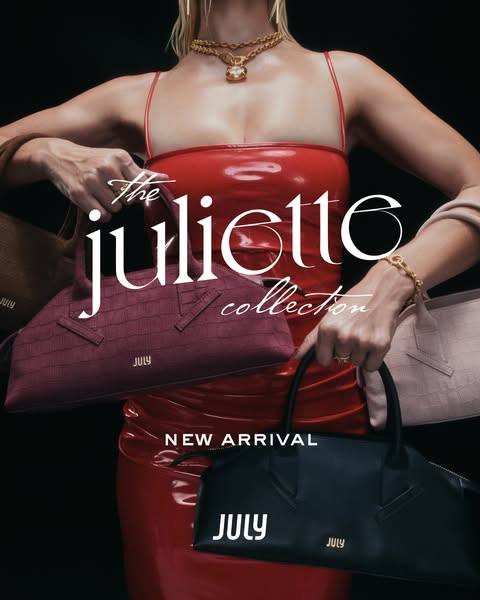 This image ad promotes the Juliette collection of bags from the brand July. A model wearing a red dress holds three diff