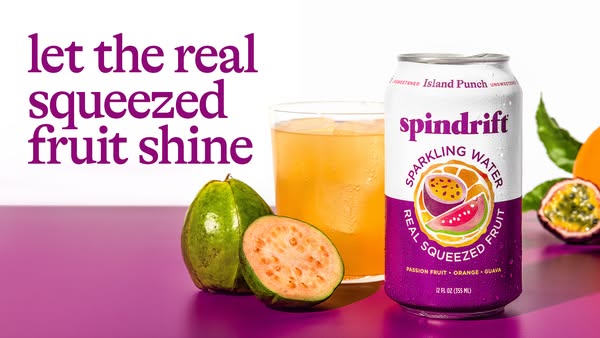Image ad for Spindrift sparkling water highlighting the real squeezed fruit in their Island Punch flavor.