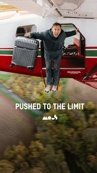 This ad features a man standing in the doorway of an airplane with a MOOS brand suitcase. The text overlay states, &quot