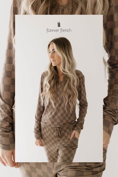 This ad features a woman wearing a brown and tan checkered lounge set from Forever French. The ad's framing and warm