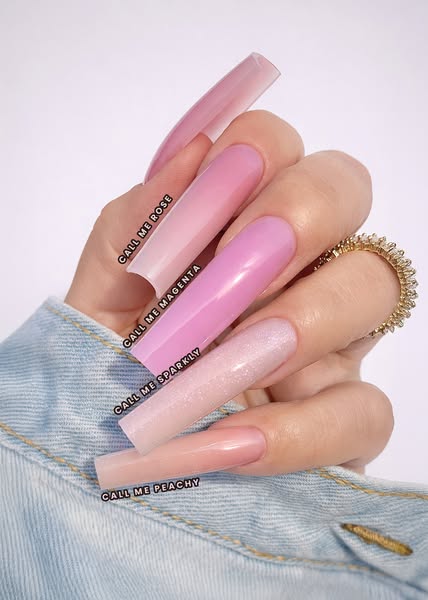 This image ad showcases a hand with long, square-shaped acrylic nails, each painted in a different shade of pink from a