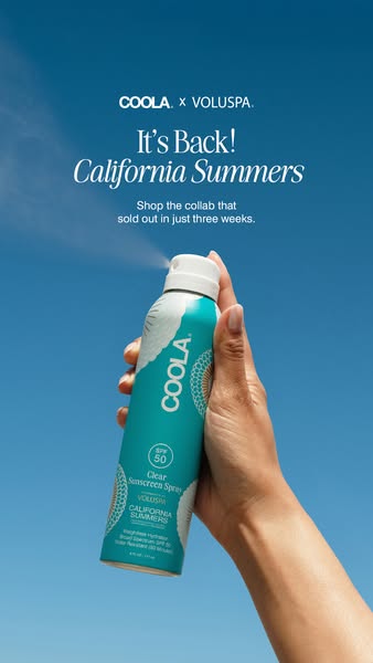 This image ad promotes the COOLA and VOLUSPA collaboration California Summers SPF 50 sunscreen spray. It features a hand