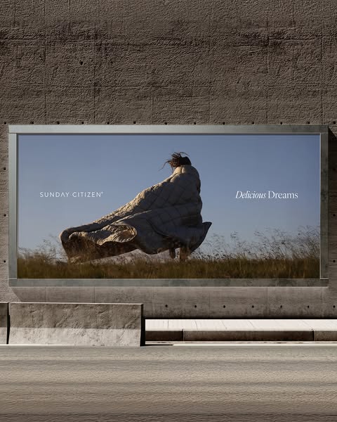 This ad showcases a person wrapped in a Sunday Citizen comforter with the text "Delicious Dreams".