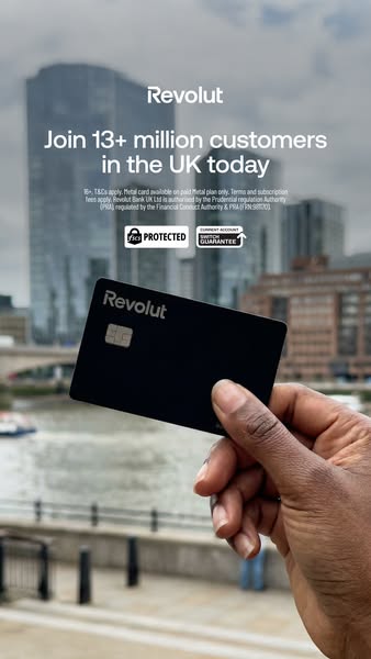This Revolut ad is for potential customers in the UK. It features a black Revolut card being held in a hand, with a city