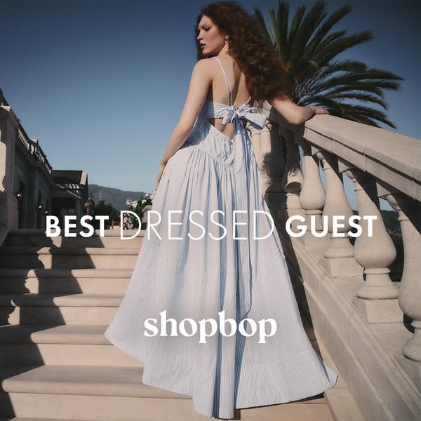 This ad features a woman in a blue and white striped dress. The ad promotes Shopbop and is likely aimed at women looking