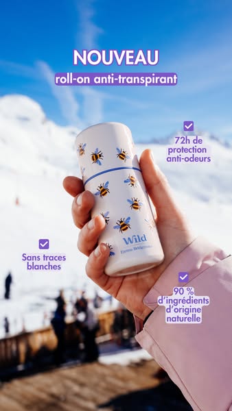 This image ad for Wild deodorant features a woman holding the product in front of a snowy mountain background. The ad hi