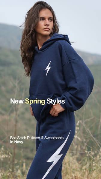 This ad showcases a matching navy blue lounge set with a white lightning bolt design. The ad highlights the new spring s
