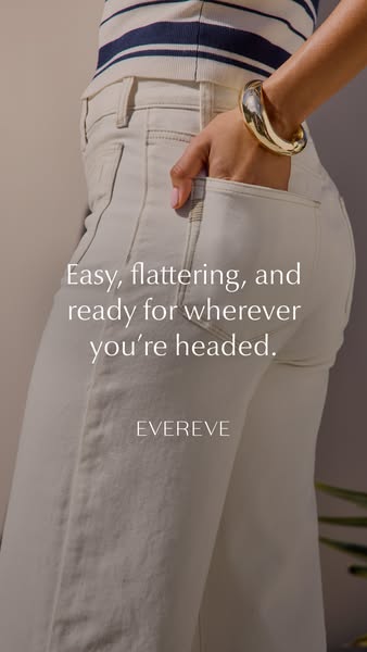 This image ad from Evereve showcases a pair of off-white wide-leg pants. The ad emphasizes the comfort and versatility o