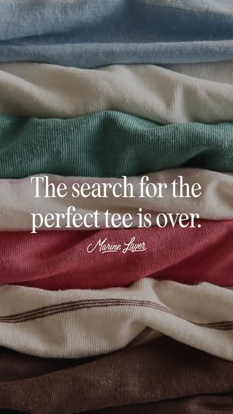 This ad for Marine Layer features a stack of folded t-shirts in various colors, with a text overlay that reads, "Th