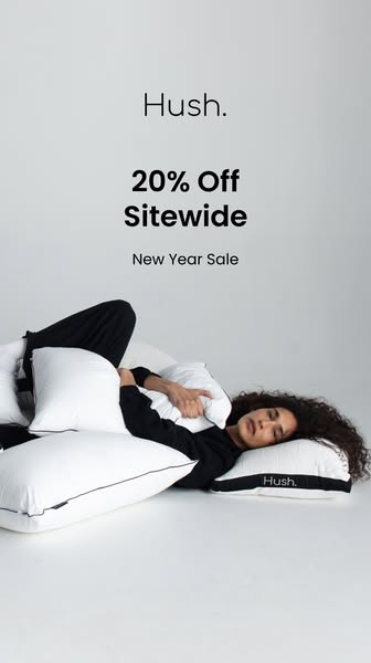 This image ad for Hush promotes a New Year Sale with 20% off sitewide. It features a person lying among several white pi