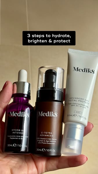 This ad features three Medik8 skincare products: a hydrating serum, a vitamin C serum, and a day cream with SPF. The ad 