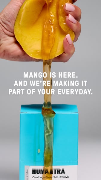 This ad for Humantra highlights the brand's mango-flavored electrolyte drink mix. The ad shows a hand squeezing a ma