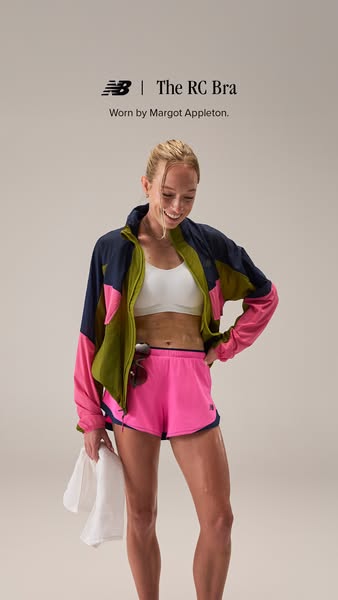 This ad features a woman wearing athletic apparel from New Balance, specifically the RC Bra. The woman is smiling and lo