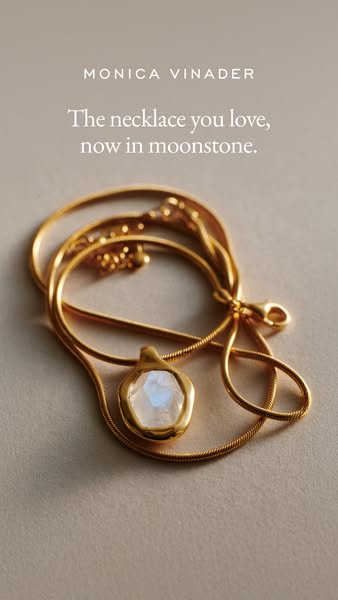 This ad showcases a Monica Vinader necklace, specifically highlighting a new moonstone version of a popular necklace. Th