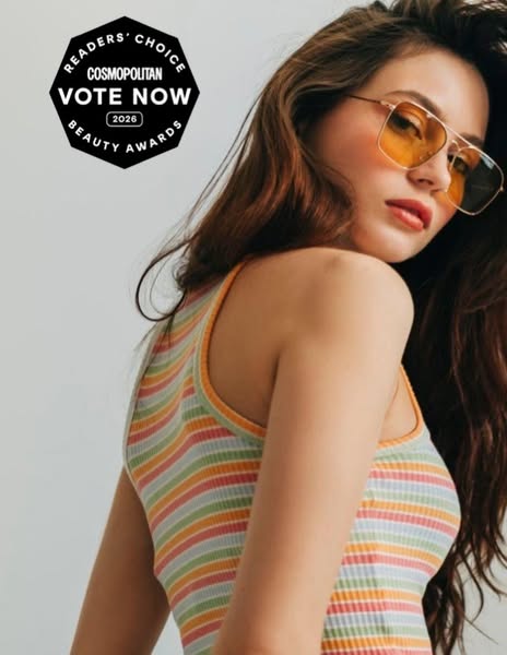 An image ad for the Cosmopolitan Readers' Choice Beauty Awards features a young woman wearing yellow sunglasses and 