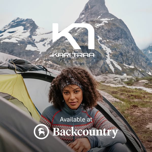 This image ad features a woman sitting inside a tent with a mountain range in the background. The ad promotes Kari Traa 