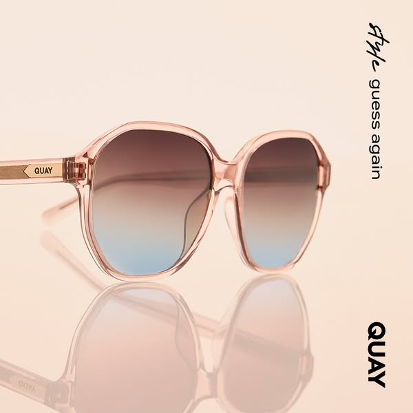 This ad for Quay features a pair of pink sunglasses with a gradient lens. The ad utilizes a clean, minimalist aesthetic 