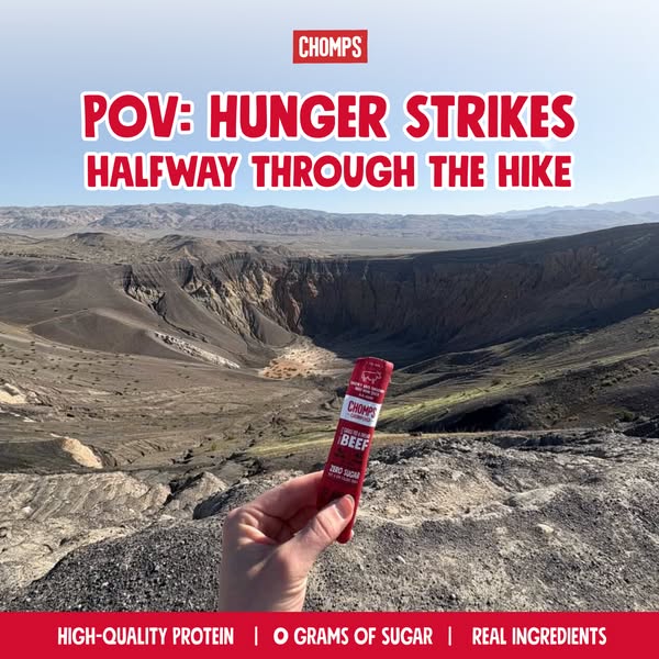 An image ad showing a person on a hike who is hungry, and they are holding a Chomps beef stick. The ad aims to show how 