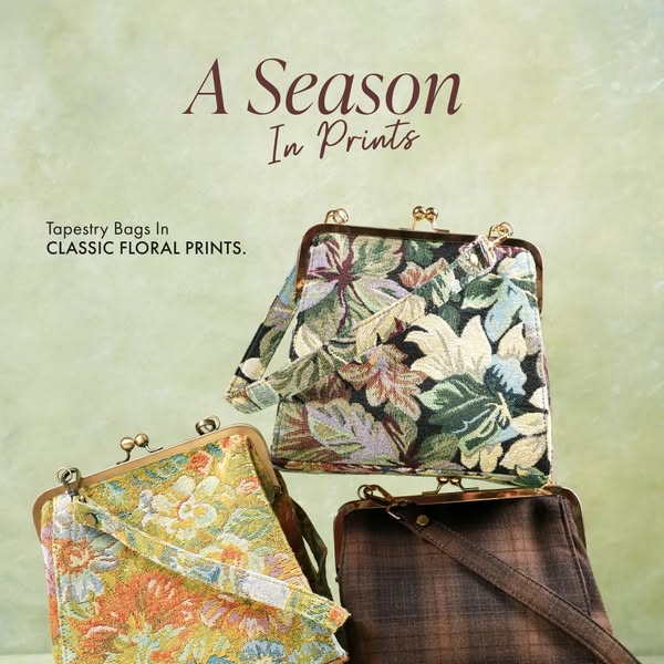 An image ad featuring a stack of three tapestry bags in different floral patterns against a soft green backdrop, highlig