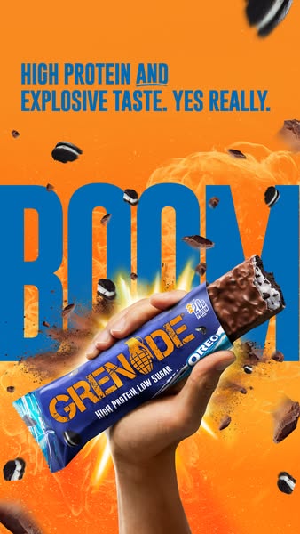 This image ad showcases a Grenade Oreo protein bar. The background is bright orange, and the word 'BOOM' is in l