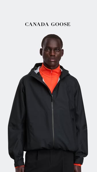 This image ad showcases a black, hooded Canada Goose jacket worn by a Black male model. The brand name is displayed at t