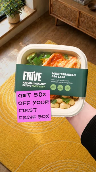 An image ad featuring a Frive Mediterranean Sea Bass meal. It showcases the prepared meal in its container with a sticky