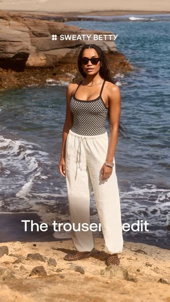 This ad showcases a woman wearing Sweaty Betty trousers on a beach. The ad intends to drive viewers to browse the collec