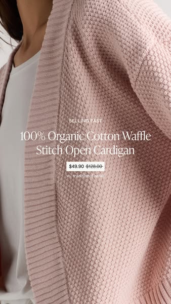 This image ad promotes a 100% Organic Cotton Waffle Stitch Open Cardigan. The ad highlights its discounted price compare