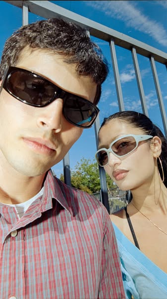 An ad showcasing the brand's sunglasses, the ad features a male and female model each wearing a pair of sunglasses f
