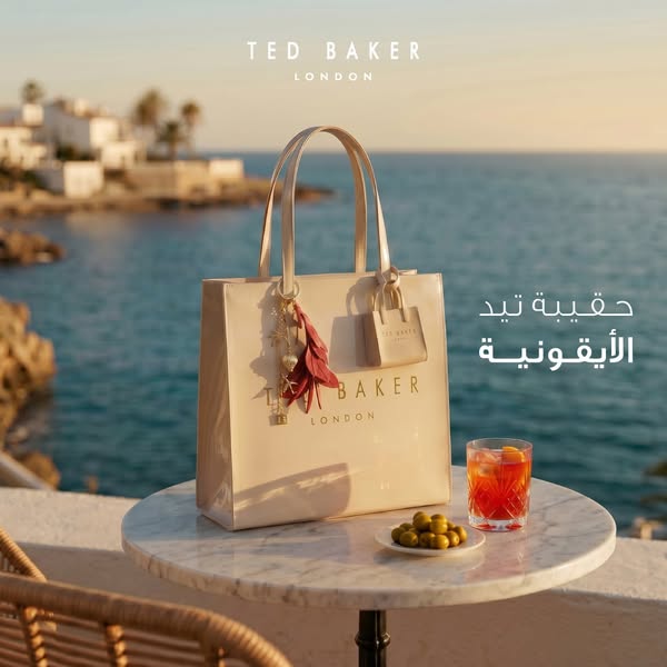 The ad features a Ted Baker London handbag on a white table with a drink and olives, with a water view in the background