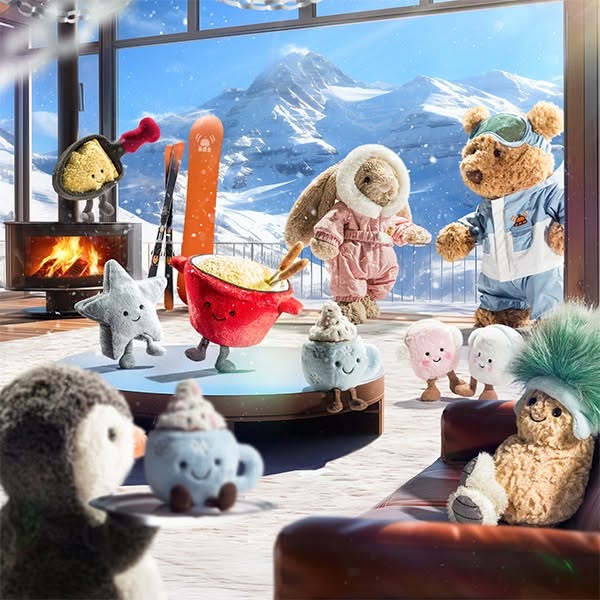 This ad features a collection of Jellycat stuffed toys in a winter-themed setting, creating a cozy and whimsical atmosph