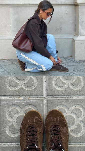 This ad shows a woman kneeling on a sidewalk and tying the laces on her brown Adidas Samba sneakers, shot from two persp