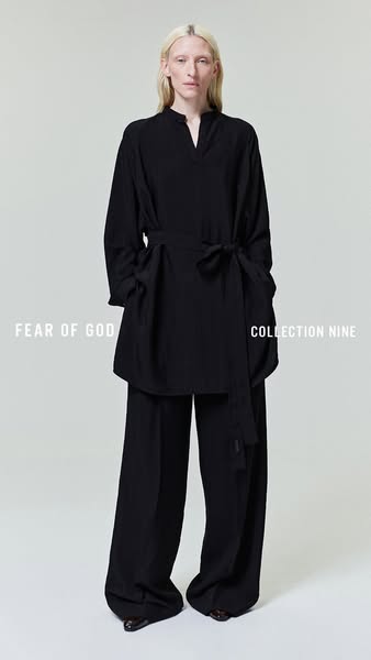 The ad showcases a black long-sleeve top and matching pants from Fear of God's Collection Nine, presented on a model